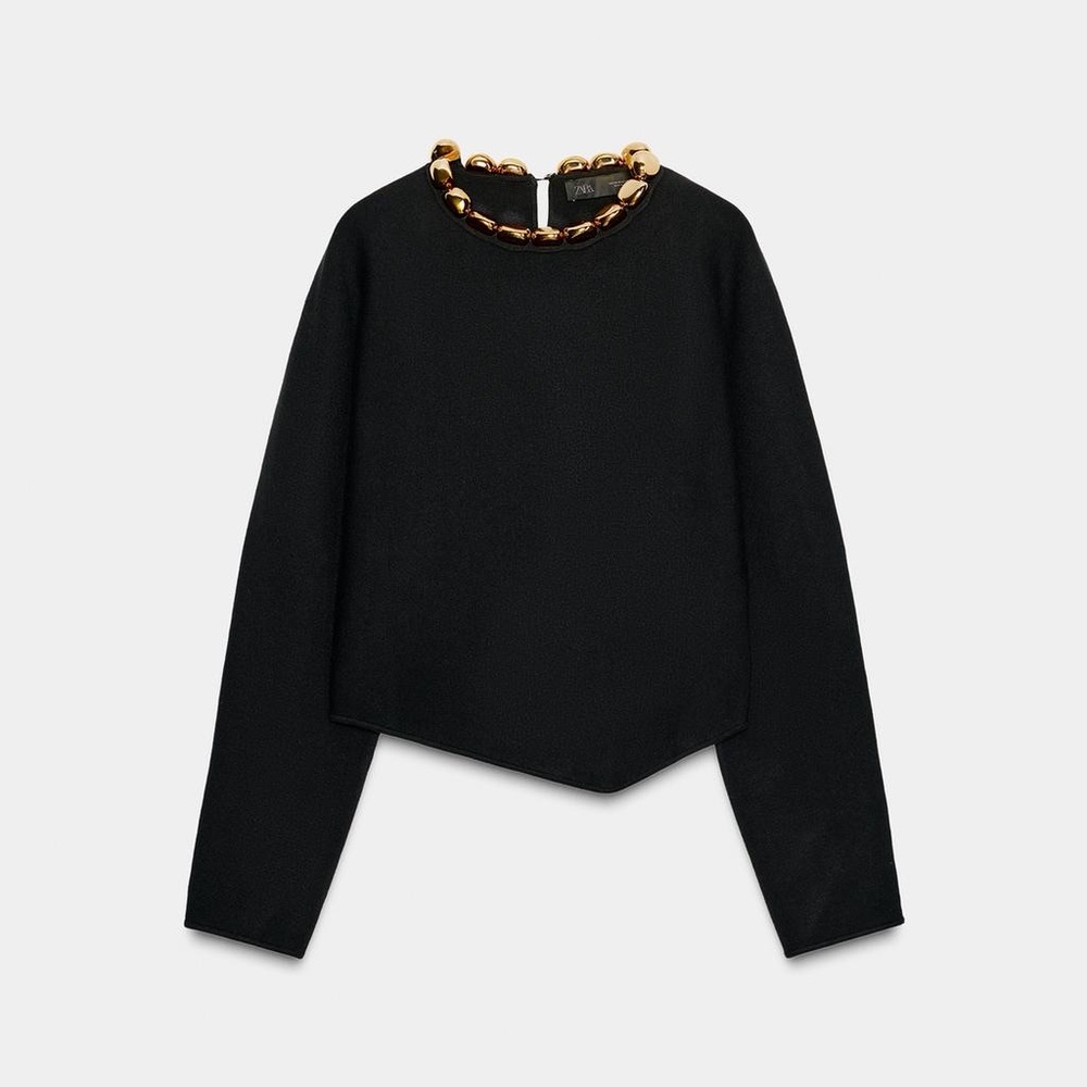 Elegant Black Top with Gold Accents